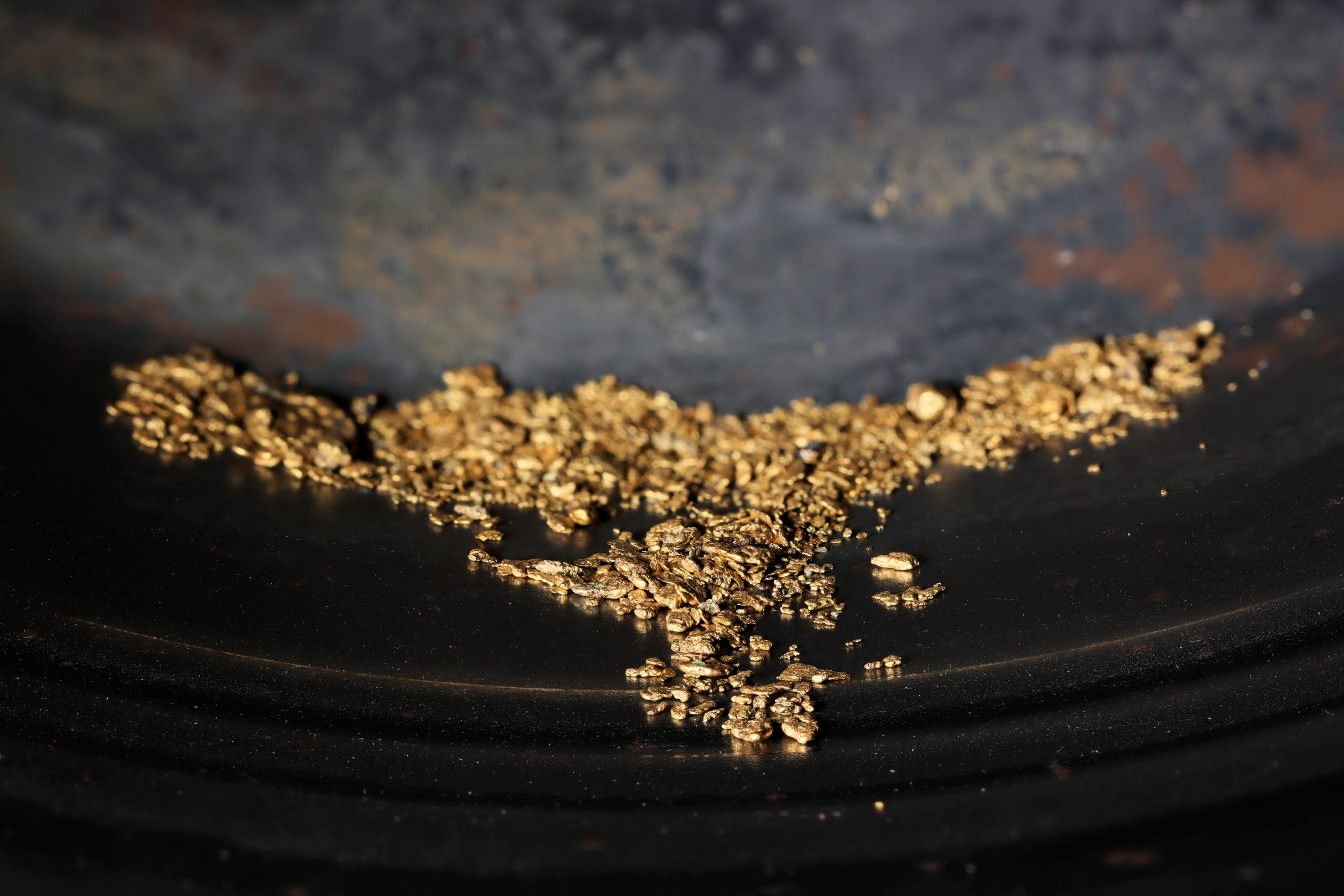 hand panned river gold nuggets in gold pan